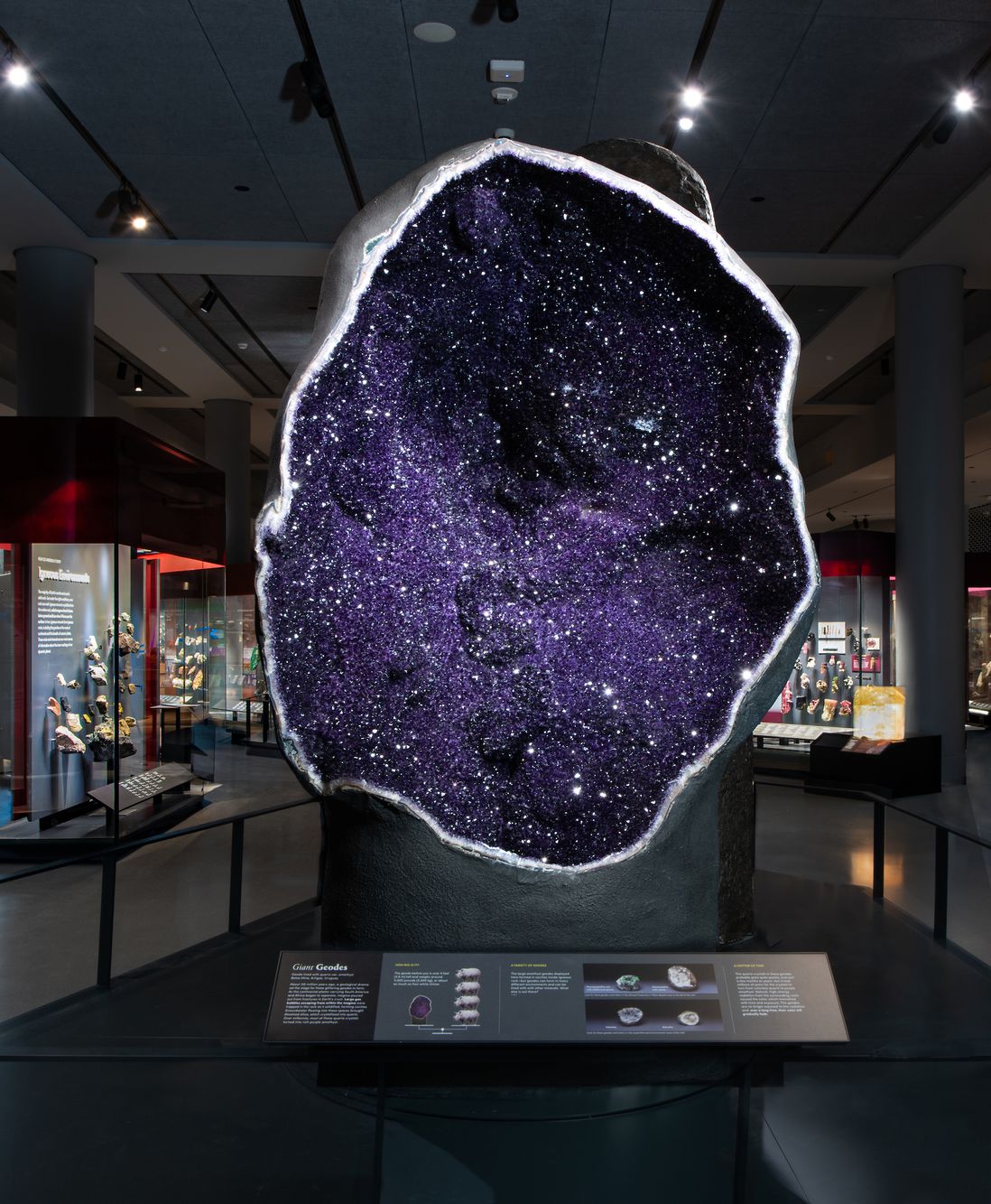 A huge open geode with sparkling purple stones inside